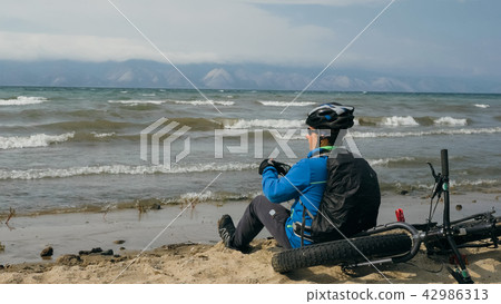 Fat bike also called fatbike or fat-tire bike in summer driving on the beach. Fat bike also called fatbike or fat-tire bike in summer driving on the beach. 42986313