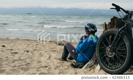 Fat bike also called fatbike or fat-tire bike in summer driving on the beach. 42986315