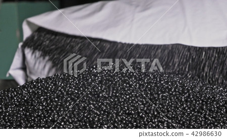 Plastic black gray granulated crumb. Manufacture of plastic water pipes factory. Process of making 42986630