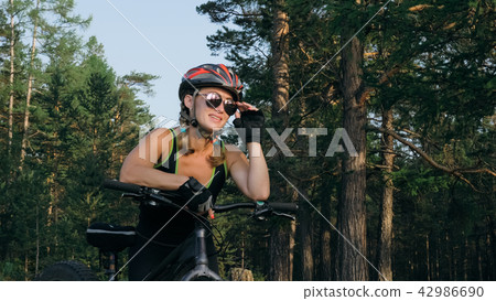 Fat bike also called fatbike or fat-tire bike in summer riding in the forest. 42986690