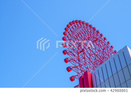 blue sky and red ferris wheel 42988801