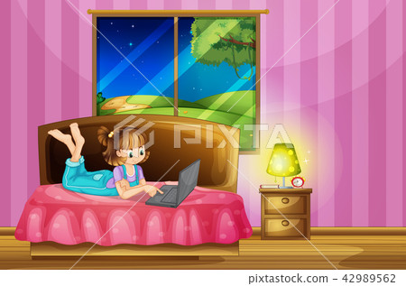 Teenage girl on her lapton in a bedroom 42989562
