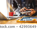 businessman or Designer using smart phone with businessman or Designer using smart phone with 42993649