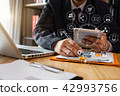 close up of businessman working with tablet close up of businessman working with tablet 42993756