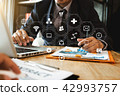 businessman using mobile phone and laptop computer businessman using mobile phone and laptop computer 42993757
