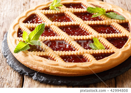 Delicious Italian crostata pie with cherries Delicious Italian crostata pie with cherries 42994808