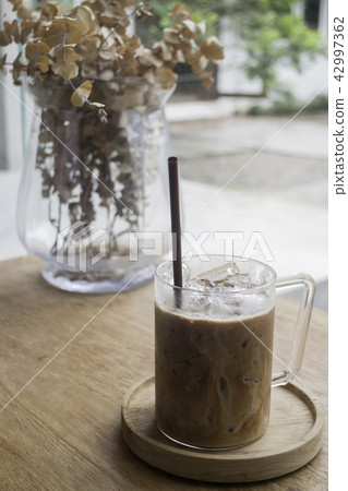 Iced milk mocha on wooden table 42997362