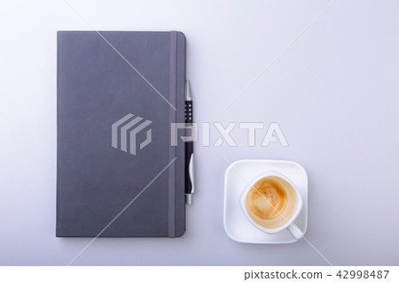 office table with notebook, keyboard cup of coffee 42998487