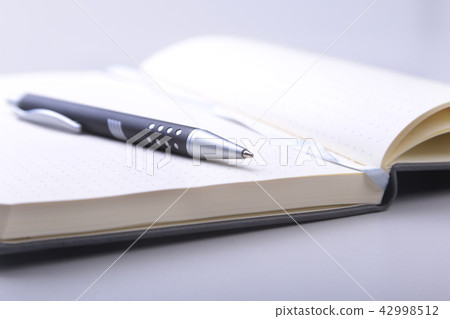 office table with notebook and pen. copy space. 42998512