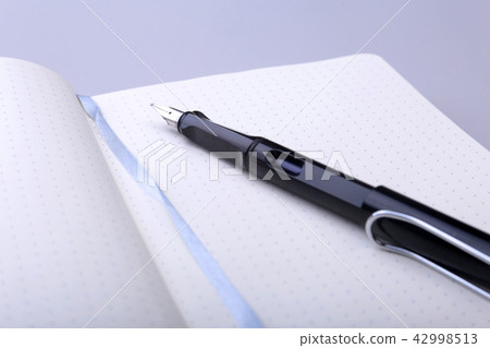 office table with notebook and pen. copy space. 42998513