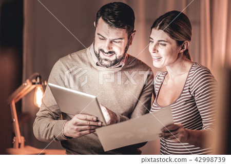 Cheerful managers comparing reports 42998739