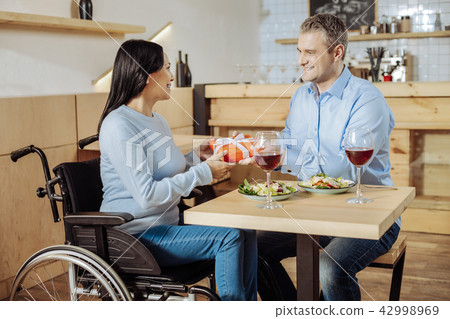 Beautiful lady getting a gift from a man 42998969