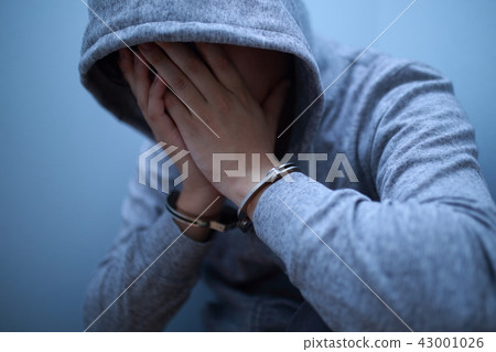 Arrest of handcuffs (crime illegal criminal bad suspect case criminal suspicious intruder thief face none thugs) Arrest of handcuffs (crime illegal criminal bad suspect case criminal suspicious intruder thief face none thugs) 43001026