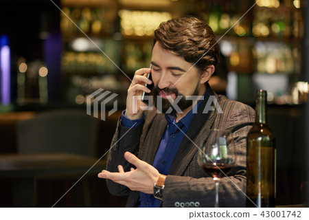 Man talking on phone Man talking on phone 43001742