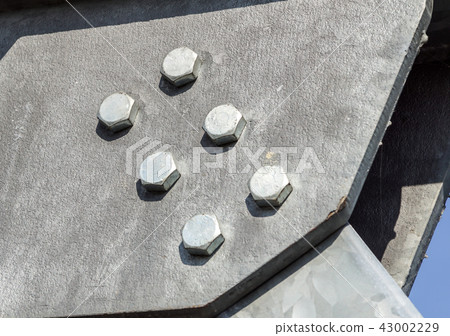 Hex head bolts, fasten beams and girders together in an industrial application. Hex head bolts, fasten beams and girders together in an industrial application. 43002229