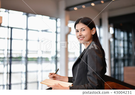 Business concept. Young businesswoman is working hard. Business concept. Young businesswoman is working hard. 43004231