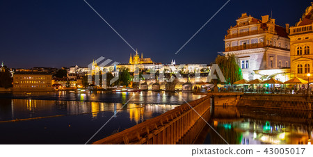 Prague by night. Prague Castle and Charles Bridge reflected in Vltava River. View from Smetana 43005017