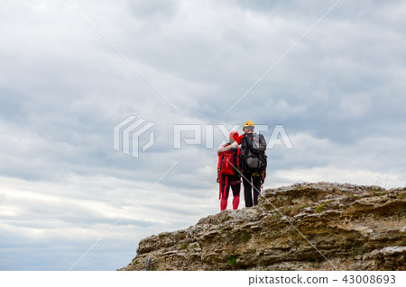 Photo from back of hugging man and woman tourist on mountain 43008693