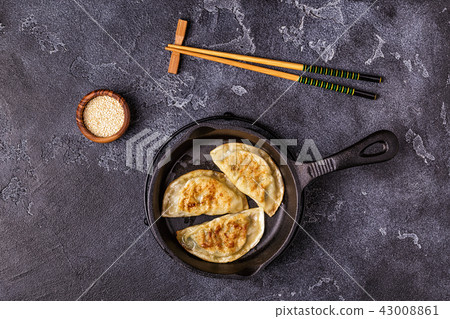 Gyoza or dumplings snack with soy sauce. Gyoza or dumplings snack with soy sauce. 43008861