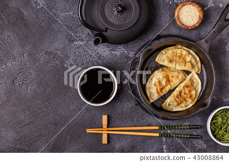 Gyoza or dumplings snack with soy sauce. Gyoza or dumplings snack with soy sauce. 43008864