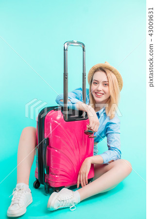 beautiful holiday-maker with pink baggage 43009631