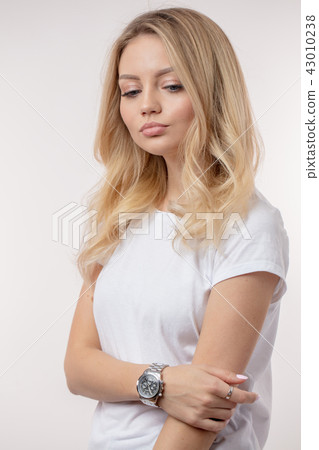Portrait of a thoughtful pleasant young housewife Portrait of a thoughtful pleasant young housewife 43010238