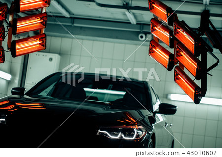 lamps for drying the ceramic coating are behind car lamps for drying the ceramic coating are behind car 43010602