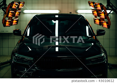lamps for drying the ceramic coating are behind car lamps for drying the ceramic coating are behind car 43010612