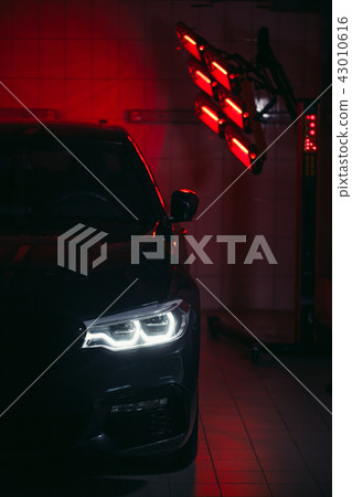 lamps for drying the ceramic coating are behind car lamps for drying the ceramic coating are behind car 43010616