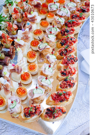 catering banquet table with different food snack 43010673