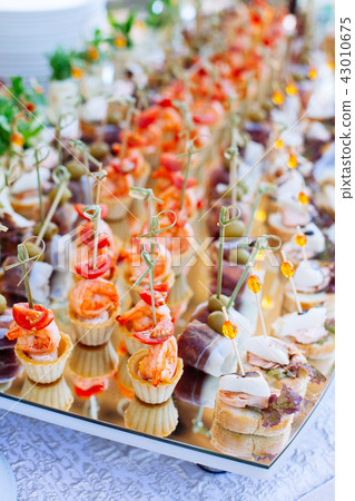 catering banquet table with different food snack 43010675