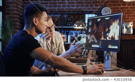 People are working on video edit of documentary 43010956