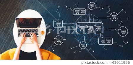 Online shopping theme  with person using a laptop 43011996