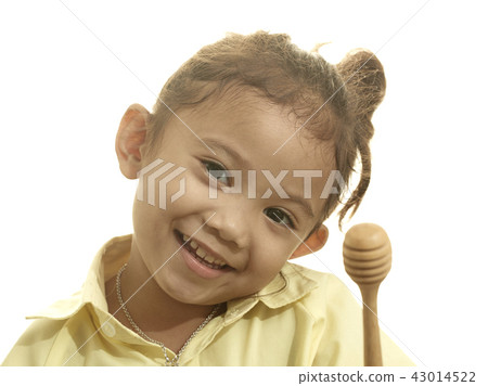 girl holding wooden stick dipper 43014522