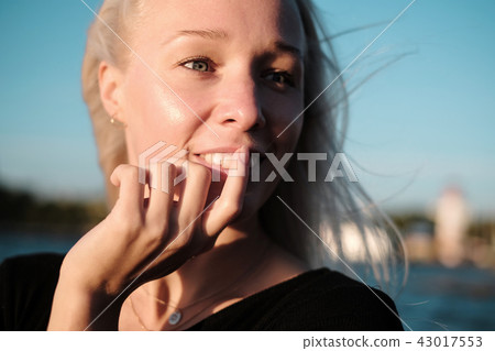 Lifestyle portrait of smilyng young blonde woman Lifestyle portrait of smilyng young blonde woman 43017553