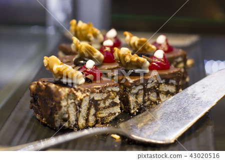 Mosaic chocolate cake with walnut and berries Mosaic chocolate cake with walnut and berries 43020516