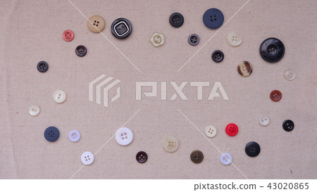 An assortment of round buttons with empty space 43020865