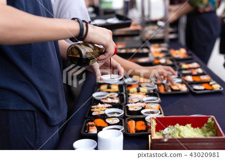 Hand pouring sushi sauce with wasabi on Thailand 43020981