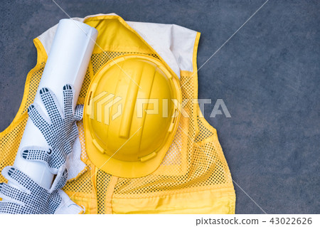Yellow safety helmet with glove, blueprint 43022626