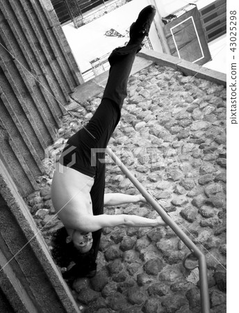 Male dancer doing a classic ballet pirouette Male dancer doing a classic ballet pirouette 43025298