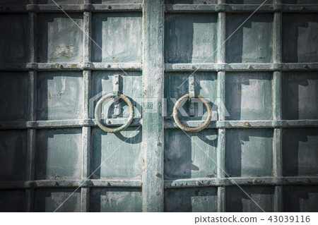 Ancient forged door with a rings Ancient forged door with a rings 43039116