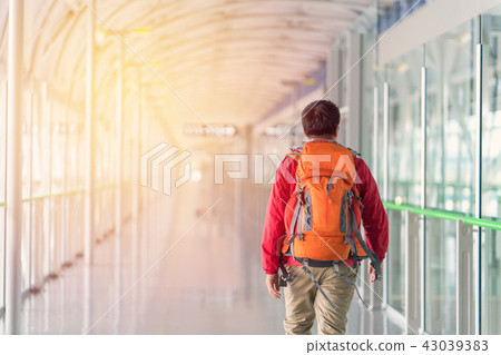 Young man traveling backpacker with Backpack Young man traveling backpacker with Backpack 43039383