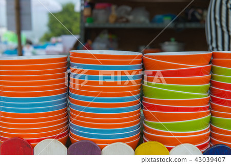 Many dishware stacked on table In the kitchen Many dishware stacked on table In the kitchen 43039407