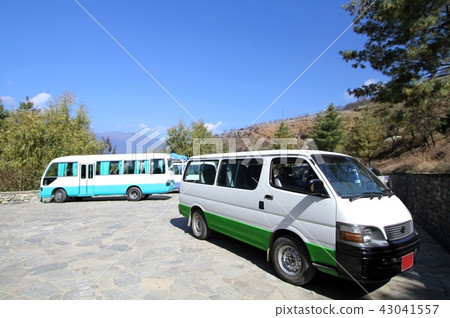 Two vans at parking space on the hill, Bhutan Two vans at parking space on the hill, Bhutan 43041557