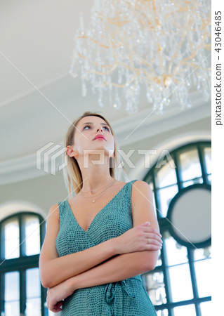 portait of beautiful redhead girl in dreen dress  43046485