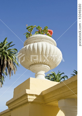 Decorative flowerpot on house wall roof, Spain Decorative flowerpot on house wall roof, Spain 43046880