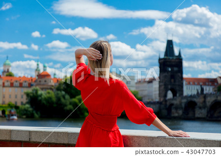 Beautiful girl in red dress travel in Prague Beautiful girl in red dress travel in Prague 43047703