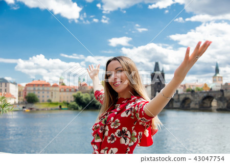 Beautiful girl in red dress travel in Prague 43047754