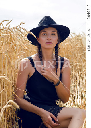 woman in a black dress 43049543