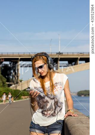 Young women rollerblading with music Young women rollerblading with music 43052964